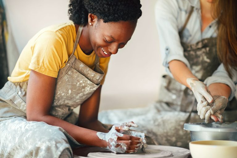 a lady working on pottery making