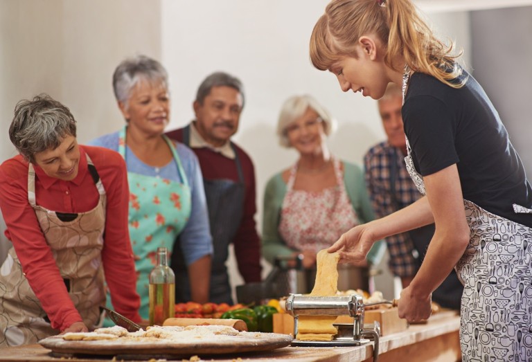 Older people making pasta