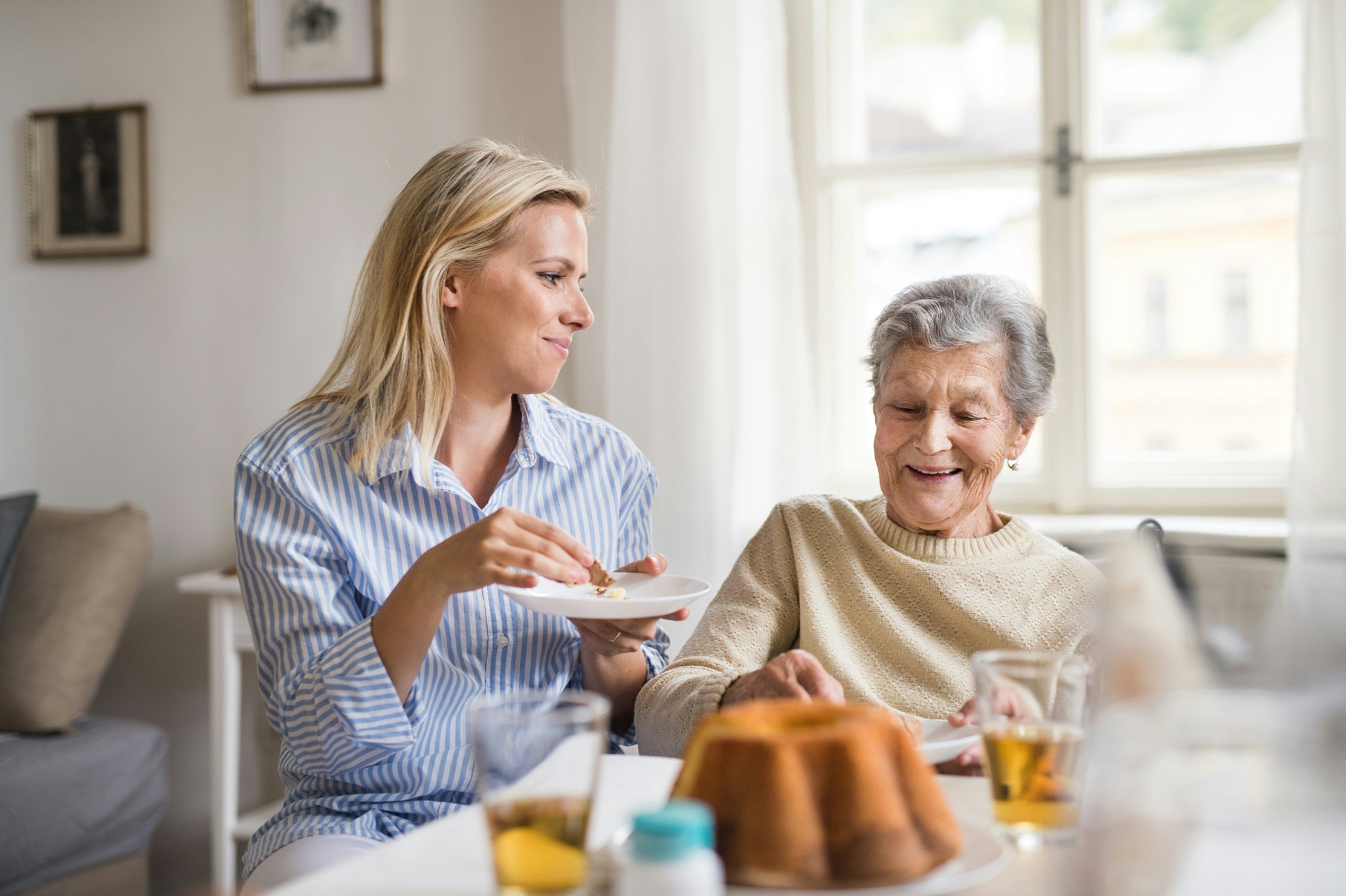 Older lady speaking to younger lady