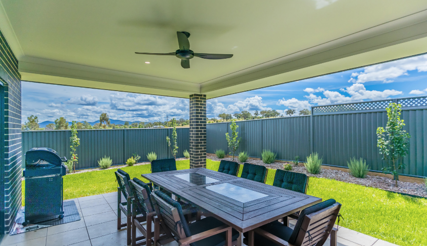backyard undercover area with tables and chairs